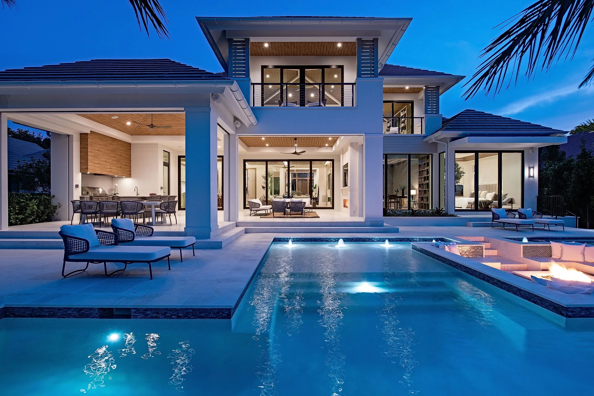 Illuminated residence, pool and spa at blue hour